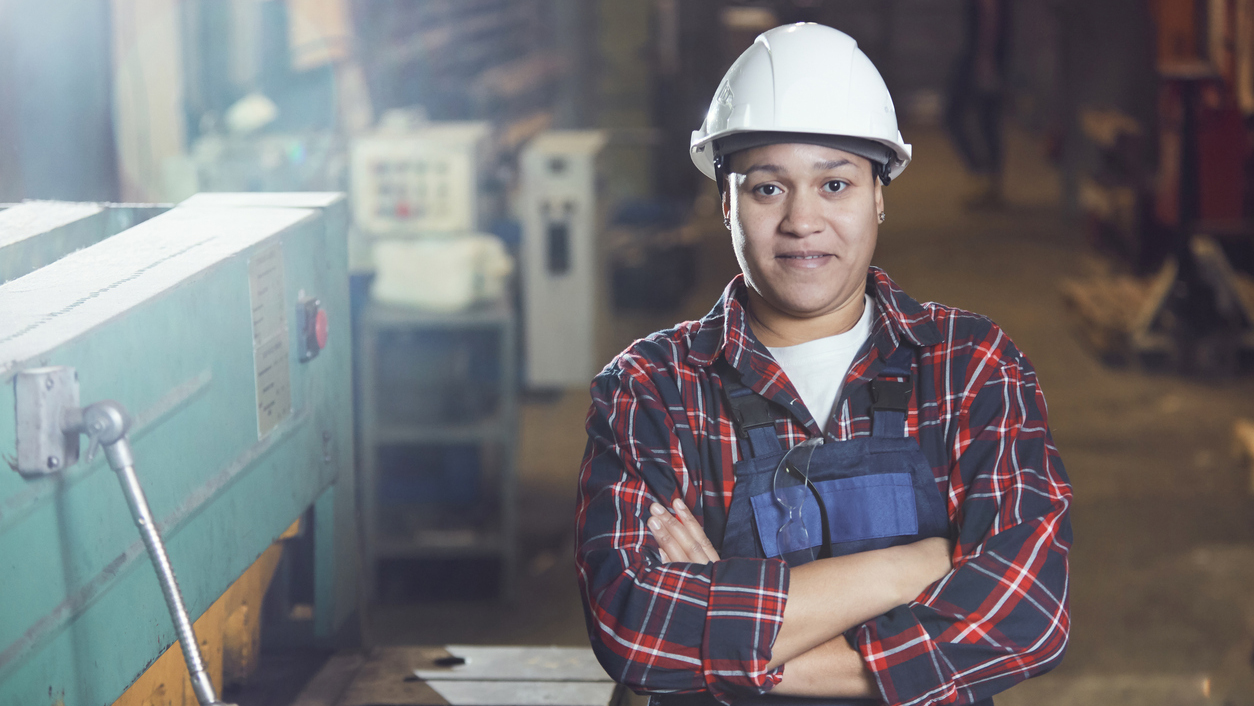 Mixed-Race Female Worker Posing at Plant